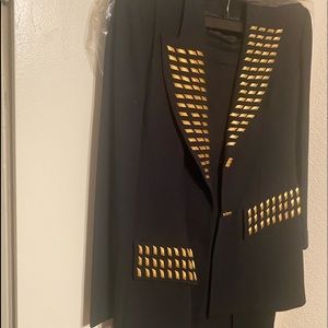 Regine , black polyester suit S-14, trimmed in golden nuggets, midi skirt